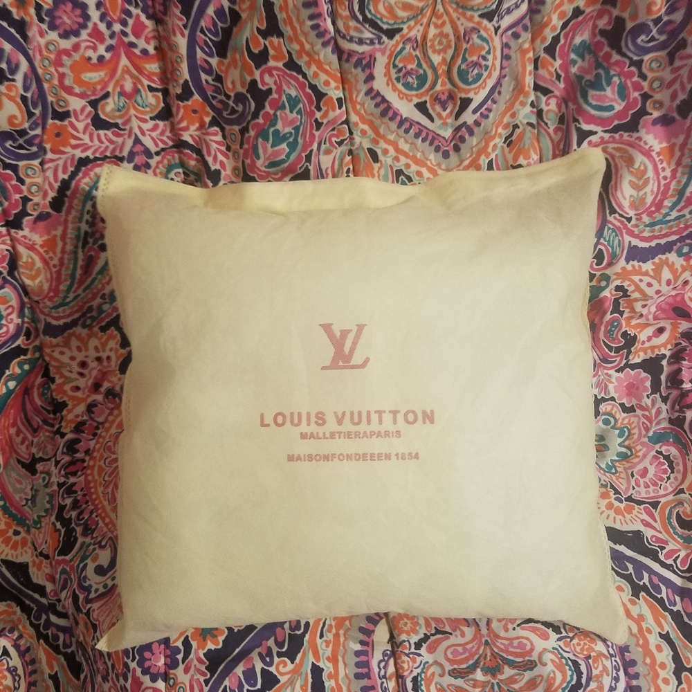 Louis Vuitton pillow made from dust cover.